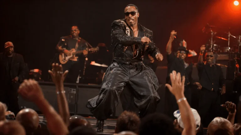MC Hammer performing on stage, tied to his net worth built through touring income