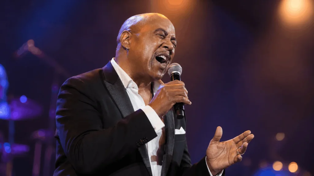 spotlighted stage representing Peabo Bryson's musical legacy and net worth