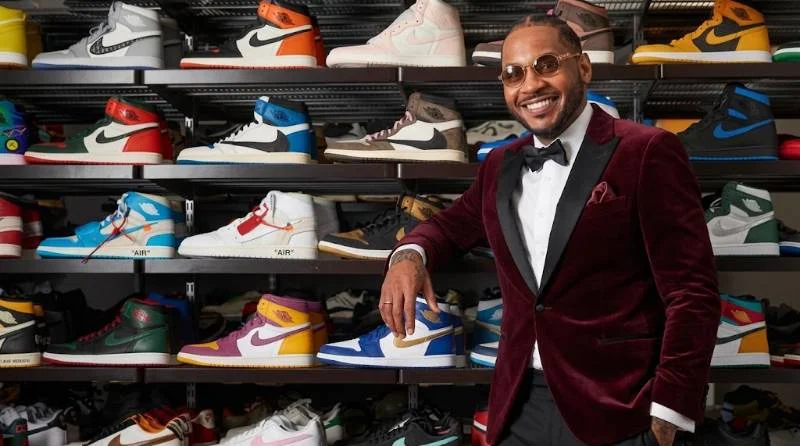 Carmelo Anthony reviewing a prototype sneaker in a design studio