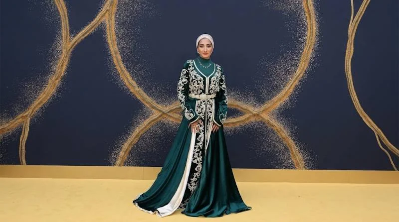 Zainab Jiwa preparing a custom premiere outfit at home