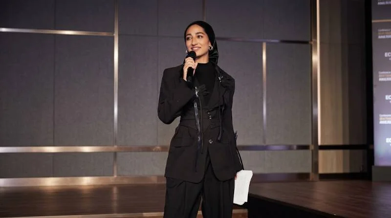 Zainab Jiwa hosting a red carpet interview at a film event